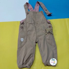 تصویر بیلر پیشبندی کتان و جین بغل عروسک 