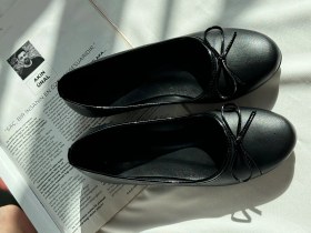 تصویر عروسکی چرمی مشکی 