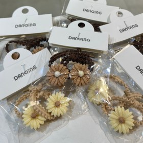 تصویر کش مو فانتزی دخترانه طرح گل - قهوه ای 