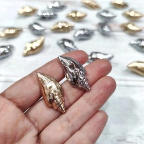 تصویر دکمه دفرمه طرح گوش ماهی 