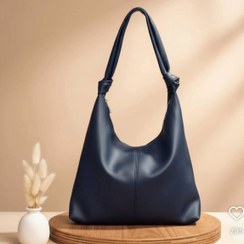 تصویر کیف زنانه چرمی مدل گره‌ای - سرمه ای 