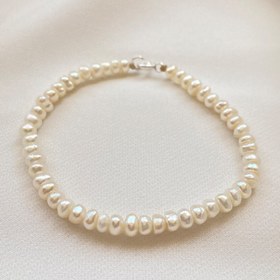 تصویر پابند مروارید باروک سفید با قفل نقره ا White baroque pearl binding White baroque pearl binding