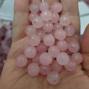 تصویر مهره جید صورتی تراش جواهری سایز 10 سوراخ دار سنگ اصل طبیعی 