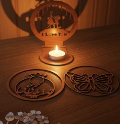 تصویر سایه‌نگار – چراغ نورپردازی چوبی با طرح‌های عاشقانه، پروانه و انار 