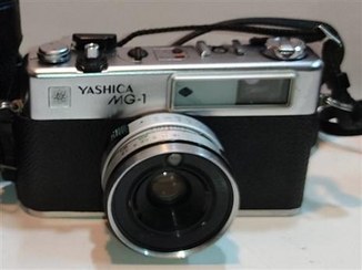 تصویر دوربین یاشیکا MG-1 بابندوکیف ودرب لنز 