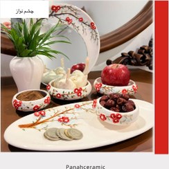 تصویر هفت‌سین چشم‌نواز قاب آینه و ۷ ظرف سرامیکی دست‌ساز 