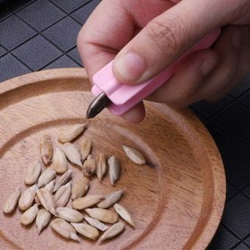 تصویر پوست کن دستی تخمه 