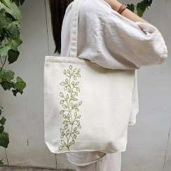 تصویر ساک پارچه‌ای زیپ‌دار طرح برگ 