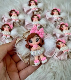 تصویر گلسر عروسکی پر دار 