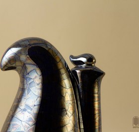 تصویر تندیس سرامیکی مرغ هما لعاب ترکدار سورمه ای