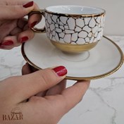 تصویر فنجان و نعلبکی چای خوری طلایی نسترن 