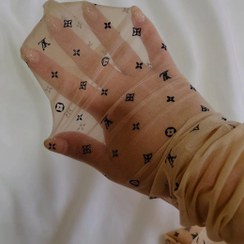 تصویر جوراب شلواری طرحدار زنانه مشکی و کرم 