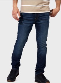 تصویر شلوار جین باریک شست‌وشو شده متوسط برند american eagle Mid Wash Slim Fit Jeans