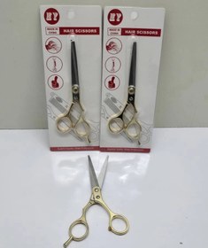 تصویر قیچی آرایشگری طلایی 