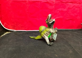 تصویر فیگور دایناسور کوچک موزیکال گوشتی - دایناسور کد Small musical meaty dinosaur figure