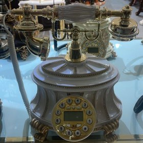 تصویر تلفن رومیزی کد ۱۰۲ 