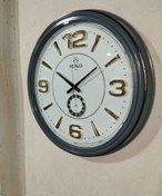 تصویر ساعت دیواری سیکو مدل 110 سایز ۶۰ سانتی طوسی با اعداد آبکاری سه‌بعدی 