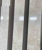 تصویر سنگ تراورتن رامشه کرم روشن هاله دار 