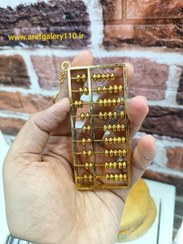 تصویر چرتکه فلزی ۹ سانتی با مهره های متحرک 