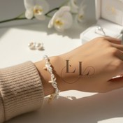 تصویر دستبند زنانه مرواریدی طرح ستاره دریایی با قفل 