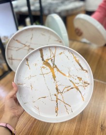 تصویر سینی گرد طرح ماربل طلایی 