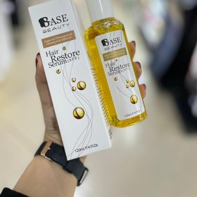 تصویر سرم مو بازسازی‌کننده ضدآفتاب مدل Hair Restor حجم 120 میل بیس بیوتی Base Beauty Sunscreen Restoring Hair Serum Model Hair Restor Volume 120 ml