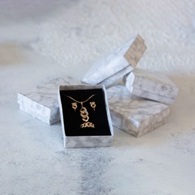 تصویر جعبه جواهرات 12 عددی بسته بندی شده مدل نیم ست سنگی سفید 