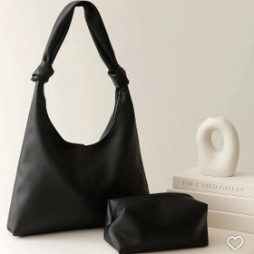 تصویر کیف زنانه چرمی مدل گره‌ای 