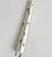 تصویر شمع قلمی طرح برگ - زمینه سفید و سبز با هم 