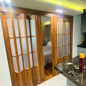 تصویر درب آکاردئونی PVC طرح چوب پنجره دار 
