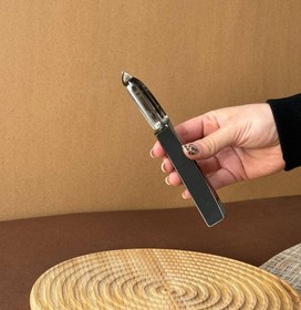 تصویر پوست کن مشکی شنگیا 