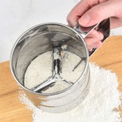 تصویر الک چرخشی استیل دسته دار 