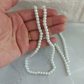 تصویر مروارید سنگی رنگ سفید ،سایز 6،بصورت ریسه 144 عددی 