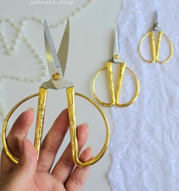 تصویر قیچی آنتیک سرنخ زن 