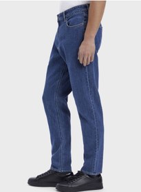 تصویر شلوار جین فیت باریک با رنگ شست‌وشو متوسط برند Calvin Klein Mid Wash Tapered Fit Jeans