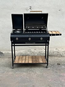 تصویر باربیکیو گازی ۹۰ سانتی پلوپز دار با رویه چدنی 