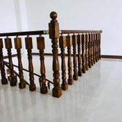 تصویر پایه نرده چوبی راه پله خراطی رنگ شده سوراخدار( میلترانسخور )کد kh33 The base of the wooden railing of the staircase is painted and perforated (Miltranskhor) (code kh33).