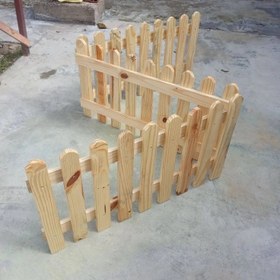 تصویر نرده چوبی دور باغچه ای Wooden fance