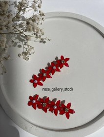 تصویر گیره‌ مو گل‌دار رزین سه‌تایی 