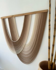 تصویر بوم ریس دو هلالی طیف کرم تا قهوه ای 