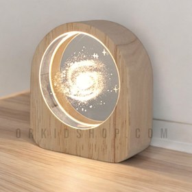 تصویر چراغ خواب شیشه ای طرح کهکشان با قاب چوبی 