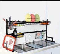 تصویر آبچکان رومیزی جلو پنجره مشکی 