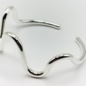 تصویر بنگل ( تکپوش) دفرمه ابکاری نقره 