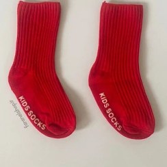 تصویر جوراب ساقدار یلدایی و کریسمسی کبریتی کف استپ دار قرمز بچگانه سایز ۲-۳ سال 