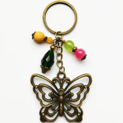 تصویر جاکلیدی بلتاگالری مدل مگان ساخته شده با پلاک پروانه و سنگ های معدنی 