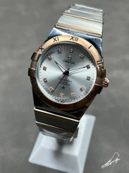 تصویر ساعت امگا کانسیلیشن نقره ای رزگلد صفحه سفید (OMEGA) 