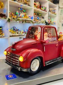 تصویر ماشین موزیکال بابانوئل کریسمس،درخت کریسمس و کادو 