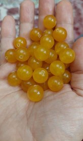 تصویر مهره سنگ جید زرد ۱۲میل طبیعی اصل سوراخ دار 