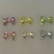 تصویر مهره پاپیون رنگی شفاف 