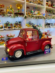 تصویر ماشین موزیکال بابانوئل کریسمس،درخت کریسمس و کادو 